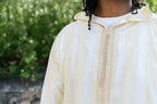 Sunshine Striped thobe — neckline detail outdoors