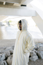 Sunshine Striped thobe — outdoor hood view