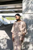 Caramel Linen thobe — outdoor side view