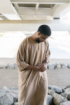 Caramel Linen thobe — outdoor view looking down