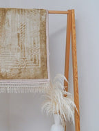 Golden Sajadah prayer mat — pattern and fringe detail