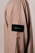 Caramel Linen thobe — sleeve label detail