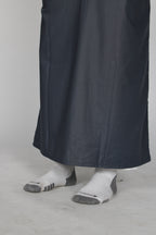 Slate Emirati thobe — hem detail