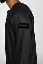 Carbon Emirati thobe — sleeve label detail