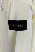 Sunshine Striped thobe — sleeve label detail